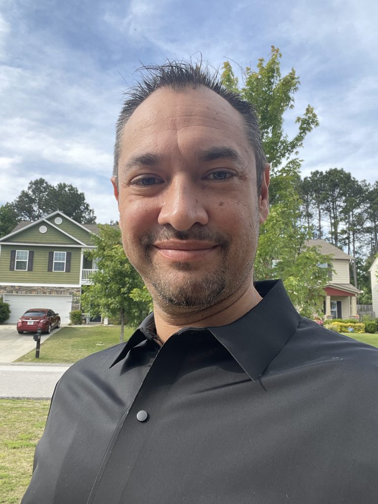 Hector Guerrero outdoors in a black shirt
