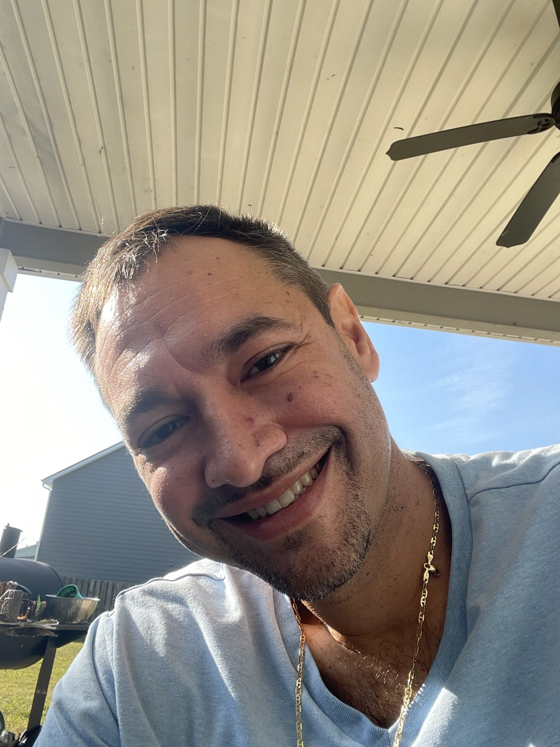 Hector Guerrero smiling outdoors